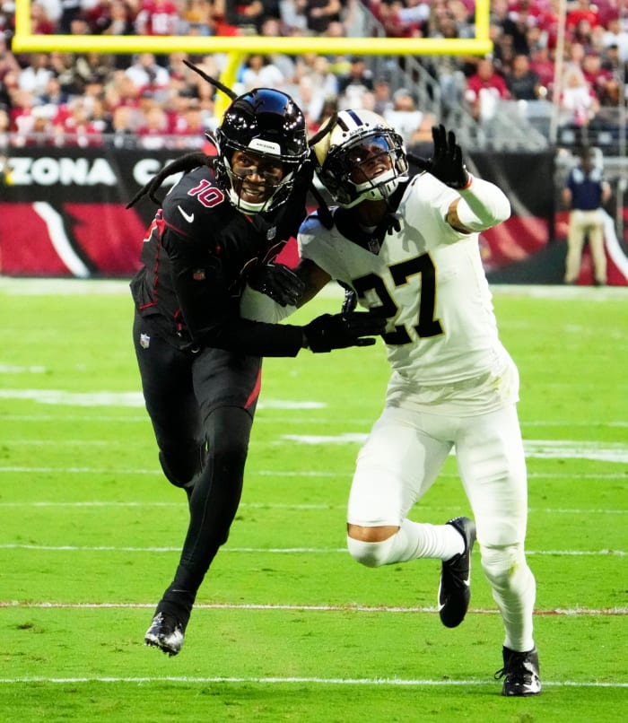 Arizona Cardinals wide receiver DeAndre Hopkins (10) battles for position with New Orleans Saints cornerback Alontae Taylor (27). Mandatory Credit: Rob Schumacher-Arizona Republic